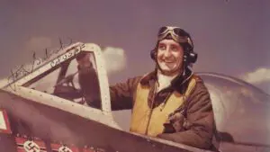 A man in an old style fighter jet.