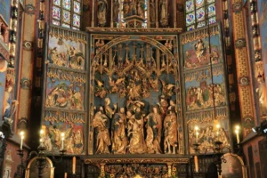 Intricate church altar with detailed religious carvings.