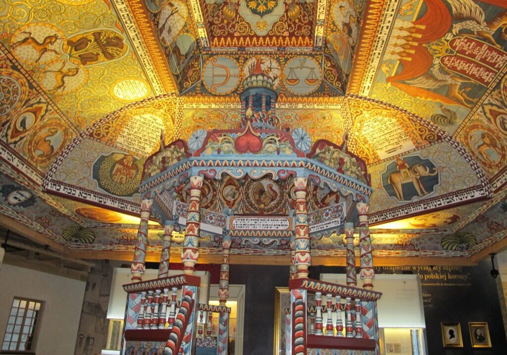 A room with many paintings on the ceiling