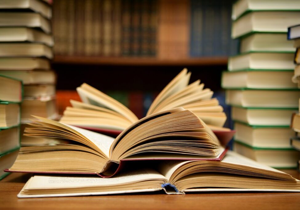 A close up of an open book on top of a table