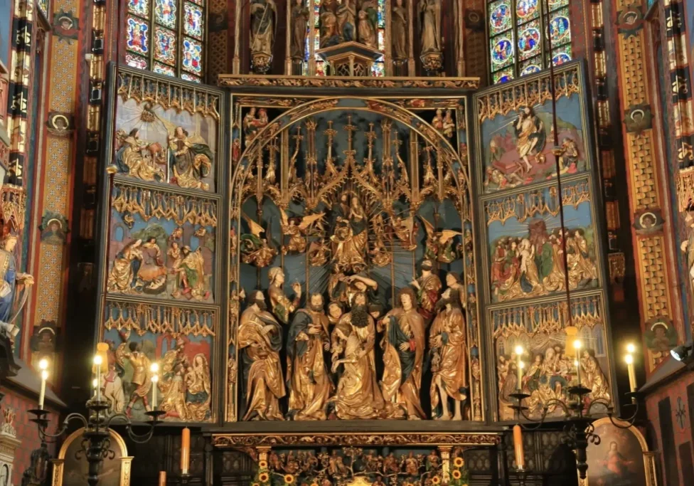 Intricate church altar with detailed religious carvings.