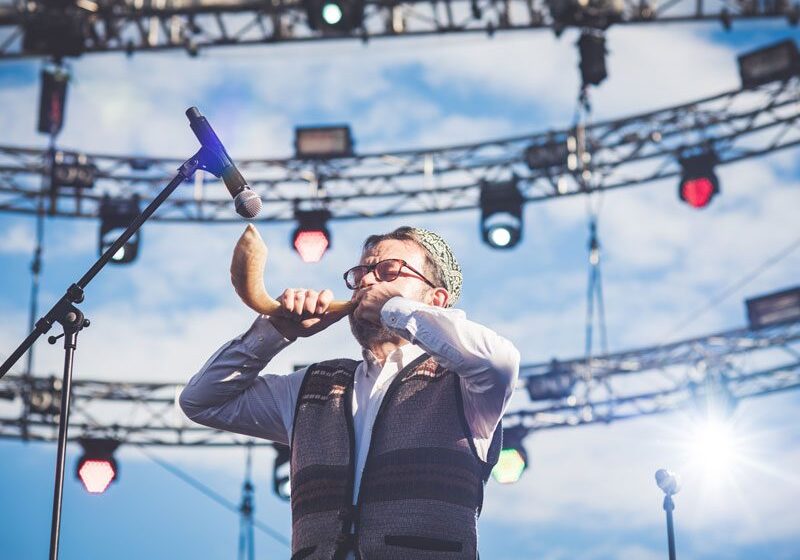 A man holding an oboe in his hand.