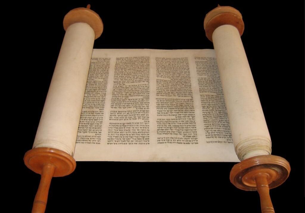 A torah scroll is shown with the pages folded.